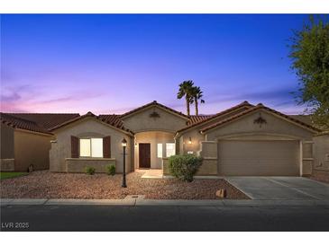 Charming single-story home featuring desert landscaping and a two-car garage at 5577 Golden Leaf Ave, Las Vegas, NV 89122