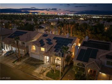 Night aerial view showcases home with solar panels in a Las Vegas neighborhood at 2528 Furnace Creek Ave, Henderson, NV 89074
