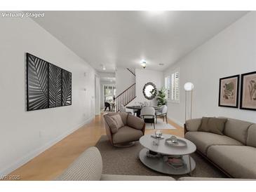Bright living room featuring modern furnishings and decor, creating a welcoming atmosphere at 4036 W Bird Man Ln, North Las Vegas, NV 89084