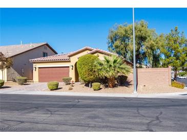 Charming single-story home with well-maintained landscaping and a two-car garage at 2804 Colts Ave, North Las Vegas, NV 89032