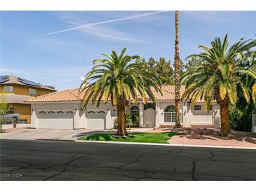 Charming single-story home with a three-car garage, well-maintained lawn, and mature palm trees at 3684 Miguels Ln, Las Vegas, NV 89120