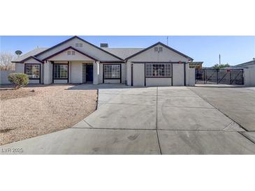 Charming single-story home featuring a low maintenance yard and a spacious driveway at 4629 Cattleman Ave, North Las Vegas, NV 89031