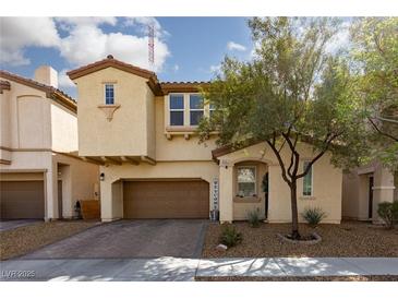 Inviting two-story home with a well-manicured front yard and a welcoming entrance at 8501 Bellery Ave, Las Vegas, NV 89143