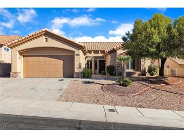 Charming single-story home featuring a two-car garage and drought-tolerant landscaping at 10408 Georgetown Pl, Las Vegas, NV 89134