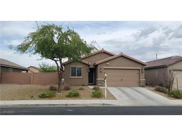 Charming single-story home with a two-car garage and desert landscaping at 1926 Neoga St, Las Vegas, NV 89115