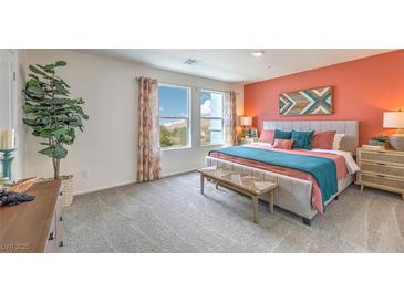 A spacious main bedroom featuring carpet floors, neutral walls, and bright windows at 6920 Lynbridge St # 49, Las Vegas, NV 89166