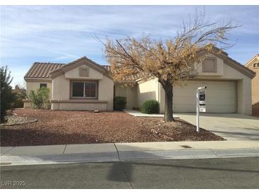 Charming single story home with neutral exterior, desert landscaping, and a covered front porch at 8501 Stan Crest Dr, Las Vegas, NV 89134