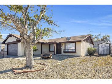 Charming single-story home with desert landscaping and a cozy front porch bench at 100 Grandview Dr, Henderson, NV 89002