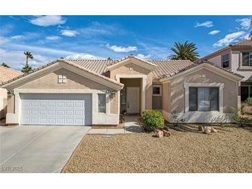 Charming single-story home featuring desert landscaping and a two-car garage at 33 Chateau Whistler Ct, Las Vegas, NV 89148