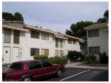 Charming condo complex featuring well-maintained facade, visible parking, and lush landscaping at 4770 Topaz St # 113, Las Vegas, NV 89121