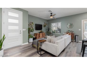 Inviting living room with modern decor, ceiling fan, and wood-look flooring at 600 N Carriage Hill Dr # 1081, Las Vegas, NV 89138