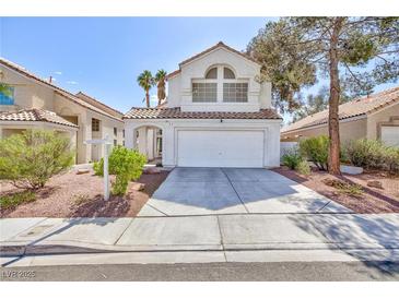 Charming two-story home with a well-maintained lawn and a two-car garage at 92 Sea Holly Way, Henderson, NV 89074
