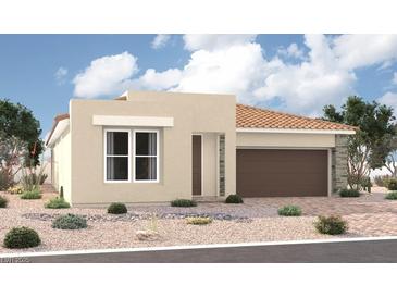 Charming single-story home featuring desert landscaping, a two-car garage, and a stylish, modern design at 10241 Tumbaga St, Las Vegas, NV 89183
