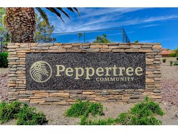Stone sign welcomes you to the Peppertree Community with manicured landscaping and desert foliage at 1839 Avacado Ct, Henderson, NV 89014