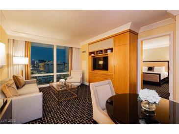 Stylish living room with plush seating, city views, and sleek entertainment center; offering luxurious comfort at 2000 Fashion Show Dr # 3526, Las Vegas, NV 89109