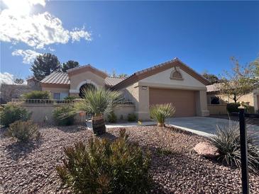 Charming single-story home with a well-maintained front yard and attached two-car garage at 2331 Scotch Lake St, Las Vegas, NV 89134