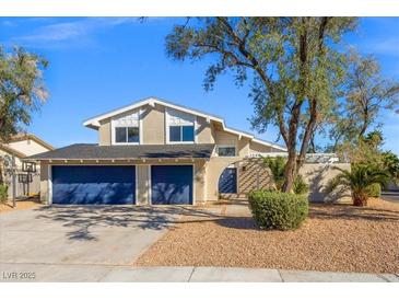 Inviting two-story home featuring a two-car garage and desert landscaping at 3588 Franciscan Ln, Las Vegas, NV 89121