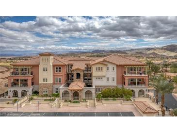 Beautiful condo building features a Spanish-style architecture with a terracotta roof and multiple balconies at 64 Strada Principale # 307, Henderson, NV 89011