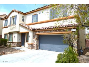 Charming two-story home featuring stone accents, a spacious driveway, and well-maintained landscaping at 8348 Mokena Ave, Las Vegas, NV 89178