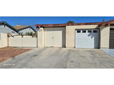 This home features multiple garage doors with driveway for easy parking and access to the house at , Las Vegas, NV 89103