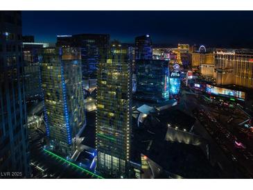 Striking Las Vegas skyline view featuring The Cosmopolitan and Aria hotels at night at 3726 Las Vegas Blvd # 609, Las Vegas, NV 89158