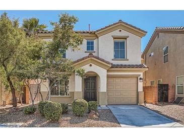 Charming two-story home with a well-maintained front yard and inviting curb appeal in a residential neighborhood at 517 Primrose Hill Ave, Las Vegas, NV 89178
