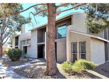 Inviting two-story home with a well-maintained landscape and a charming front porch at 530 Sellers Pl, Henderson, NV 89011