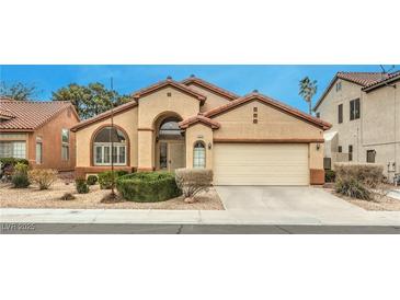 Charming single-story home with a desert landscape and a two-car garage at 1970 Jasper Creek Pl, Las Vegas, NV 89123