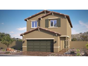 Two-story home featuring desert landscaping and a two-car garage, blending suburban charm with natural aesthetics at 9926 Ullom Dr # 4, Las Vegas, NV 89141