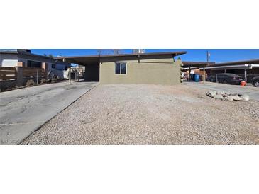 Charming single-story home featuring a covered parking area and low maintenance gravel landscaping at 1309 Exley Ave, Las Vegas, NV 89104