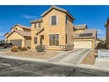 Two story home with a low maintenance front yard and a two car garage at 5024 Stone Bay Ave, Las Vegas, NV 89131
