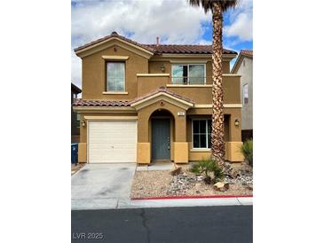 Charming two-story home with a well-maintained front yard, mature landscaping, and a convenient attached garage at 566 Shewsbury Ave, Las Vegas, NV 89178