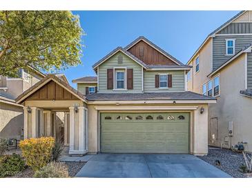 Charming two-story home featuring a two-car garage, inviting curb appeal, and well-maintained landscaping at 5916 Sierra Cliff St, North Las Vegas, NV 89031