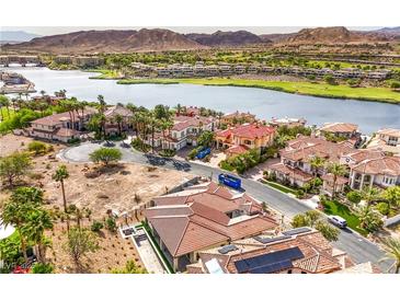 Stunning aerial view of luxury homes, lake, golf course, and mountains in a beautiful lakeside community at 9 Rue Grimaldi Way, Henderson, NV 89011
