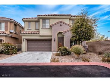 Charming two-story home features a well-maintained yard, attached garage, and inviting facade at 11820 Calle De Sol Dr, Las Vegas, NV 89138