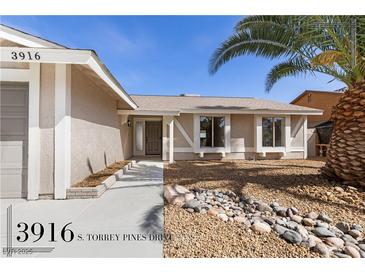 Charming single-story home featuring desert landscaping, covered entry, and a welcoming facade at 3916 S Torrey Pines Dr, Las Vegas, NV 89103