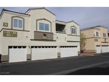 Inviting two-story condo with a well-maintained facade and attached garages at 3936 Pepper Thorn Ave # 102, North Las Vegas, NV 89081