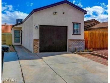 Charming single-story home with a private driveway and a well-maintained yard at 4153 Broadriver Dr, Las Vegas, NV 89108