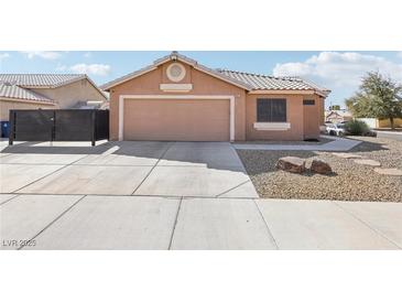 Charming single-story home with low-maintenance desert landscaping and two car garage in a quiet neighborhood at 7621 Gosport Ave, Las Vegas, NV 89131