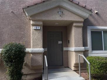 Inviting condo entrance with a covered porch and the unit number clearly displayed at 8680 Horizon Wind Ave # 101, Las Vegas, NV 89178