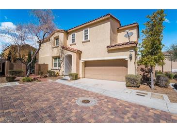 Inviting two-story home with a red-tile roof and a two-car garage in a well-maintained neighborhood at 9071 Mount Wilson St, Las Vegas, NV 89113