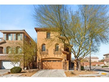 Charming two-story home with a two-car garage and a well-manicured front yard at 10133 Longoria St, Las Vegas, NV 89178