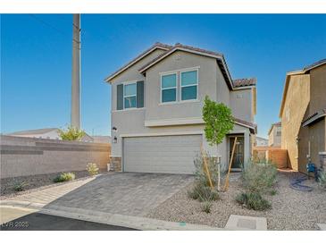Charming two-story home featuring a spacious two-car garage and low maintenance landscaping at 5691 Tinar St, Las Vegas, NV 89113