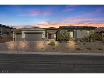 Charming single-story home featuring a three-car garage and well-maintained desert landscaping at 10062 Mountain Foothills Ave, Las Vegas, NV 89149