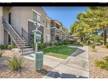 Well maintained apartment complex featuring manicured landscaping and convenient stairway access at 10245 S Maryland Pkwy # 255, Las Vegas, NV 89183