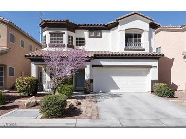 Charming two-story home featuring a manicured front yard and a two-car garage at 10783 Vestone St, Las Vegas, NV 89141