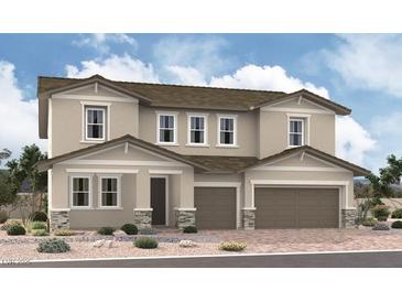 Two-story home with a two-car garage, neutral paint, stone accents, and a well-maintained desert landscape at 1175 Viento View Ave, Henderson, NV 89012