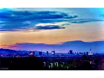 Striking sunset view of the Las Vegas skyline, creating a vibrant backdrop for this listing at 1486 Neyland Dr, Henderson, NV 89012