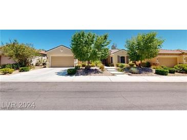 Charming single story home featuring mature landscaping and a two car garage in a quiet suburban neighborhood at 2309 Aztec Ruin Way, Henderson, NV 89044