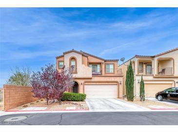 Charming home with a two-car garage, balcony, and desert landscaping at 4909 Lavaliere Ave, Las Vegas, NV 89139